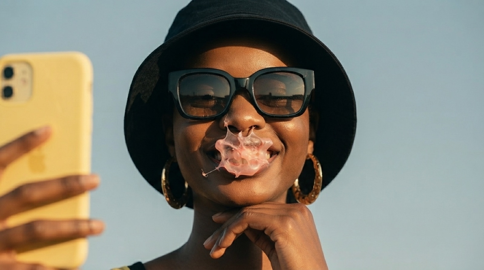 The bubble just popped — still smiling at the phone